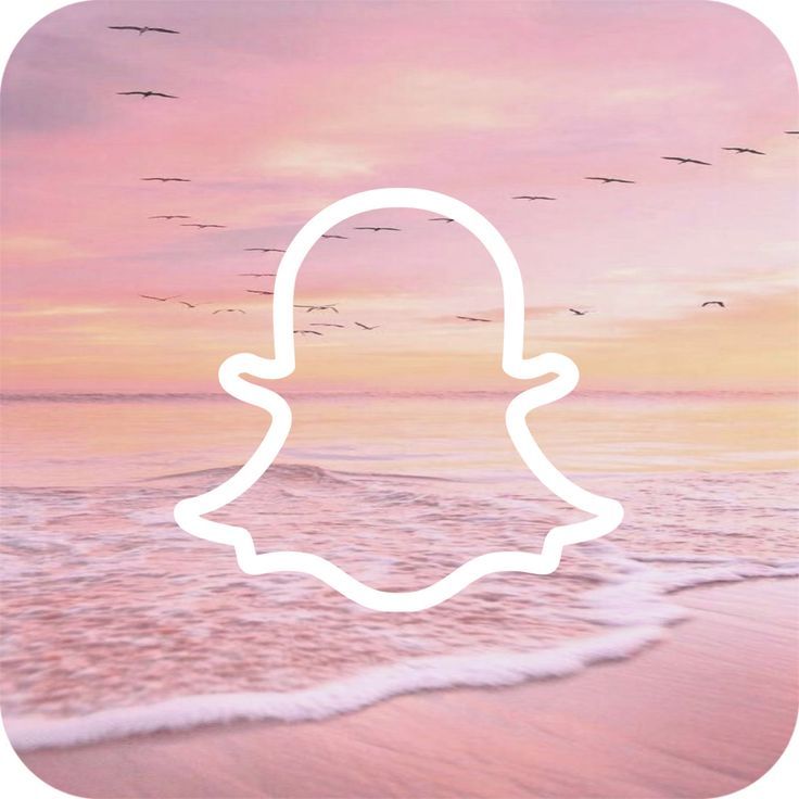 the snap icon is in front of an ocean sunset