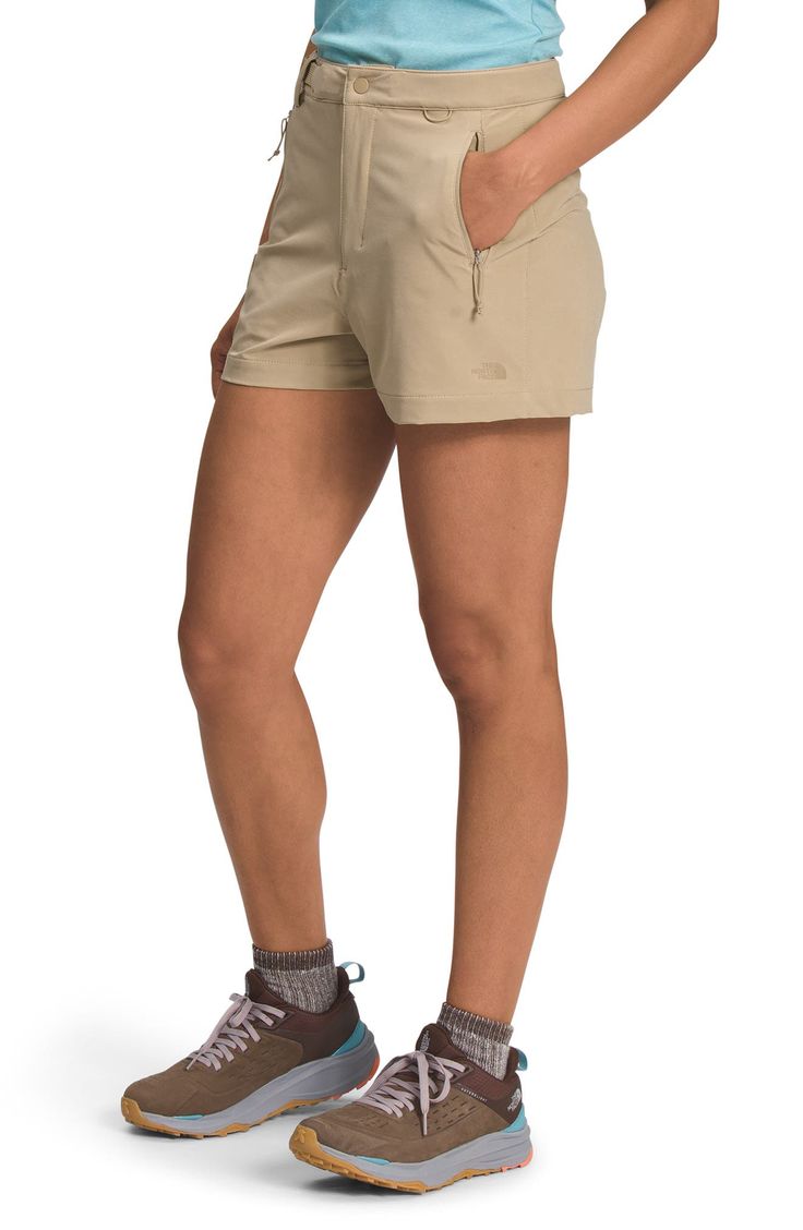 These all-purpose shorts are built with FlashDry-XD fabric for advanced moisture-wicking protection so you stay comfortable on the trail and in the city. This style also provides plenty of versatility with two side-zip pockets and a large cargo pocket that can hold your phone, keys or wallet, while a built-in webbing belt allows for a customizable fit. 3" inseam; 26" leg opening; 12 1/2" front rise; 16" back rise ( size 8 ) Zip-fly with snap closure Antimicrobial fabric engineered to inhibit the Functional Midweight Short Bottoms, Outdoor Work Shorts With Side Pockets, Casual Nylon Bottoms By The North Face, Functional Short Bottoms For Hiking, Functional Short Bottoms For Outdoor Activities, Casual The North Face Bottoms For Outdoor Activities, The North Face Nylon Bottoms For Outdoor, The North Face Sports Bottoms With Built-in Shorts, The North Face Functional Bottoms With Pockets