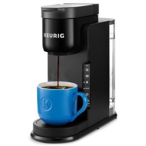 a coffee maker with a blue cup in front of it and the word beurig on