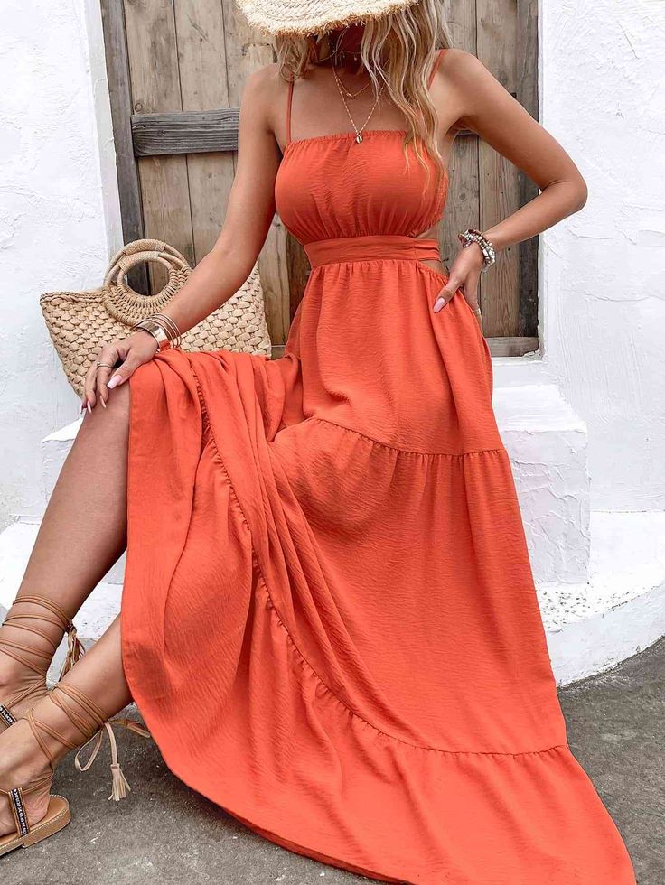 Introducing our Spaghetti Strap Cutout Tie Back Maxi Dress – a symbol of contemporary fashion and effortless elegance. This dress features delicate spaghetti straps, a chic cutout waist detail, and a playful tie-back closure. Crafted from premium materials, it transitions seamlessly from day to night, offering a comfortable and stylish look for various occasions. Celebrate your individuality and make a fashion statement with this chic maxi dress. Casual Strapless Dress With Adjustable Straps, Strapless Suspender Sundress For Beach, Summer Sling Sundress With Straps, Strapless Sundress With Adjustable Straps For Brunch, Strapless Maxi Dress With Adjustable Straps For Brunch, Beach Maxi Dress With Tie Straps And Square Neck, Vacation Suspender Dress With Tie Spaghetti Straps, Vacation Suspender Dress With Tie Straps, Sundress With Smocked Bodice And Spaghetti Straps