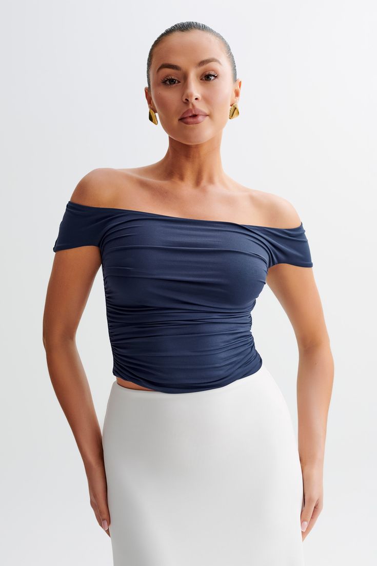 Bold bardotThe PIPER Ruched Off Shoulder Top is a chic and versatile addition to your wardrobe. Featuring a flattering Bardot neckline that elegantly frames the shoulders, this top also has stylish short sleeves. The ruched waist design accentuates your silhouette, providing a comfortable and flattering fit. Fully lined for added comfort, this top is perfect for both casual outings and more dressed-up occasions, effortlessly combining style and sophistication. Ruched Stretch Off-shoulder Top For Night Out, Ruched Stretch Off-shoulder Top, Stretch Ruched Off-shoulder Top For Night Out, Stretch Ruched Off-shoulder Top, Off-shoulder Ruched Top In Elastane, Ruched Off-shoulder Top For Summer Nights Out, Off-shoulder Ruched Top, Ruched Off-shoulder Elastane Top, Chic Summer Off-shoulder Top In Elastane