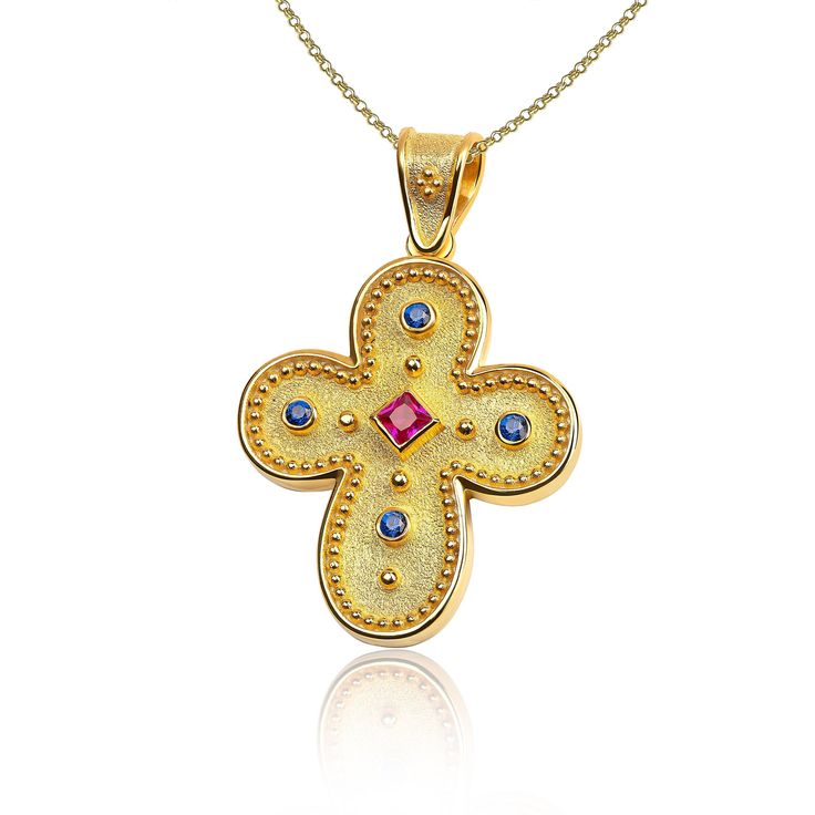 "The beauty of Byzantine style jewelry, completely handcrafted in Greece with the old-fashioned way, is omnipresent. An outstanding solid yellow gold cross with Byzantine design decorated with genuine gemstones, remains a classic and elegant choice for everyone. Bold and traditional, you will not take your eyes off. Neither will your friends! High Quality Handmade Greek jewelry! ✔ Dimensions: Inches: 1 X 0.65 inch ✔ Dimensions: Millimetres: 26 x 16.5 mm ✔ High quality product. ✔ In a gift box ✔ Byzantine Cross Jewelry For Ceremonial Occasions, Byzantine Style Cross Jewelry In Yellow Gold, Byzantine Yellow Gold Cross Jewelry, Byzantine Cross Pendant Necklace As Gift, Byzantine Style Yellow Gold Cross Pendant Jewelry, Byzantine Cross Pendant Jewelry As Gift, Byzantine Multi-stone Jewelry As Gift, Gold Byzantine Jewelry With Multi-stone, Gold Byzantine Multi-stone Jewelry