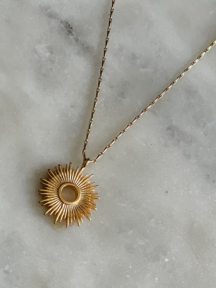 This dainty necklace is a lovely nod to a Monstrance. The radiant sunburst reminds us of the glorious transfiguration of our Lord and that we are each called to be examples of His radiance here on earth. This necklace would also make a lovely gift for First Communion when they are first taking The Eucharist and understanding of His Real Presence, or a great reminder of His Presence as a gift for Confirmation. Also available, are our Adoremus Stud Earrings. The .5" pendant is strung on a 16" barl Celestial Pendant Necklaces For Everyday, Sun And Moon Design Sunburst Jewelry Gift, Adjustable Spiritual Necklace With Sun Design, Adjustable Spiritual Sun Design Necklace, Spiritual Adjustable Sun Design Necklace, Celestial Style Necklaces With Sun Design For Gifts, Celestial Sun Design Necklaces As A Gift, Celestial Sun Design Necklaces For Gifts, Celestial Sun Design Necklaces As Gifts