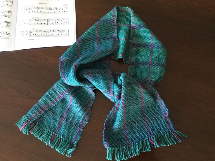 Great gift for a winter birthday! This hand woven scarf is made of wool and silk, with a tiny bit of mohair; the wool makes it warm and the silk makes it very light - it will easily fit under a coat or jacket.  The color is truly teal, with blue, green and purple peeking through. Size: 9 x 66 inches Materials:  Merino wool 45% , silk 45%, mohair 10% Care: Hand wash, cool water, dry flat; or dry clean Artisan Handmade Scarves For Winter, Handmade Artisan Scarves For Winter, Handmade Artisan Winter Scarves, Winter Gift Silk Shawl Scarf, Wool Handwoven Winter Scarves, Winter Wool Handwoven Scarves, Handwoven Wool Scarves For Winter, Handmade Alpaca Shawl Scarf, Handmade Scarves For Fall Gift