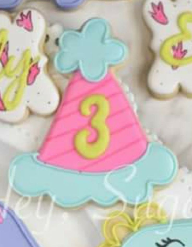 decorated cookies in the shape of animals and numbers