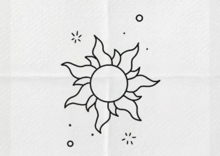 a drawing of a sun on a piece of paper