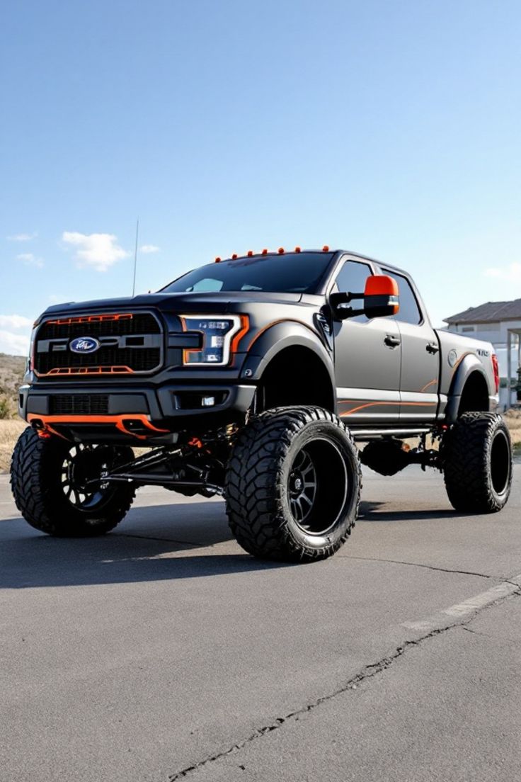 Lifted black truck with orange accents and large off-road tires on a sunny day. Lifted Ford Raptor, Pick Up Truck, Dream Trucks, Custom Ford Trucks, Ford Raptor, Jacked Up Trucks, Ford Pickup Trucks, Off Road Adventure, Custom Paint Jobs