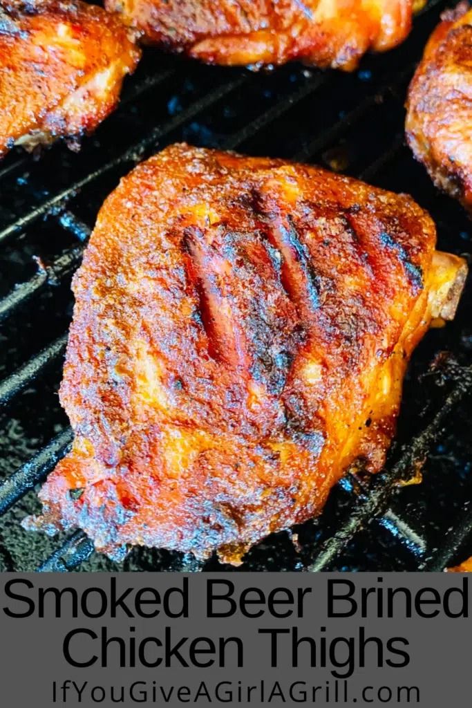 grilled chicken thighs on the grill with text overlay that reads smoked beer brined chicken thighs