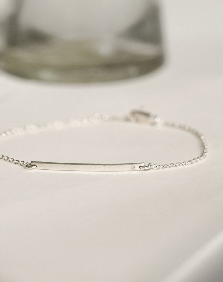 This barely-there bar bracelet is tiny, shiny and extra personal—no, really, these letters are teeny! Personalize with names, initials or dates (short inscriptions look best) and add a subtle story to your stack. PERSONALIZATION NOTES This bar bracelet is too small to include longer inscriptions, accent marks or degree symbols. Shop our medium-sized Getty Bar Bracelet or bold Serra Bar Bracelet for a bigger statement with more personalization options. Coordinates Bracelet, Bar Bracelet, Bar Bracelets, Gold Material, Real Gold, Sterling Silver Bracelets, Gold Vermeil, Solid Gold, Gold Filled