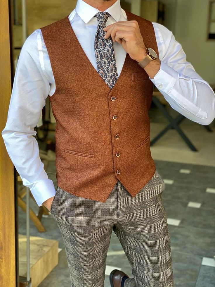 Production : slim fit buttoned vestcolor : Brown Material content:% 25 wool % 30 pes % 40 viscon. % 5 elestan.Available size: : 46-48-50-52-54-56 Slim Fit Sleeveless Vest For Fall, Winter Semi-formal Slim Fit Vest, Elegant Brown Business Vest, Winter Classic Sleeveless Blazer, Wool Business Vest With Button Closure, Elegant Brown Vest With Notch Lapel, Winter Single Breasted Business Casual Vest, Single Breasted Semi-formal Winter Vest, Elegant Brown Notch Lapel Vest