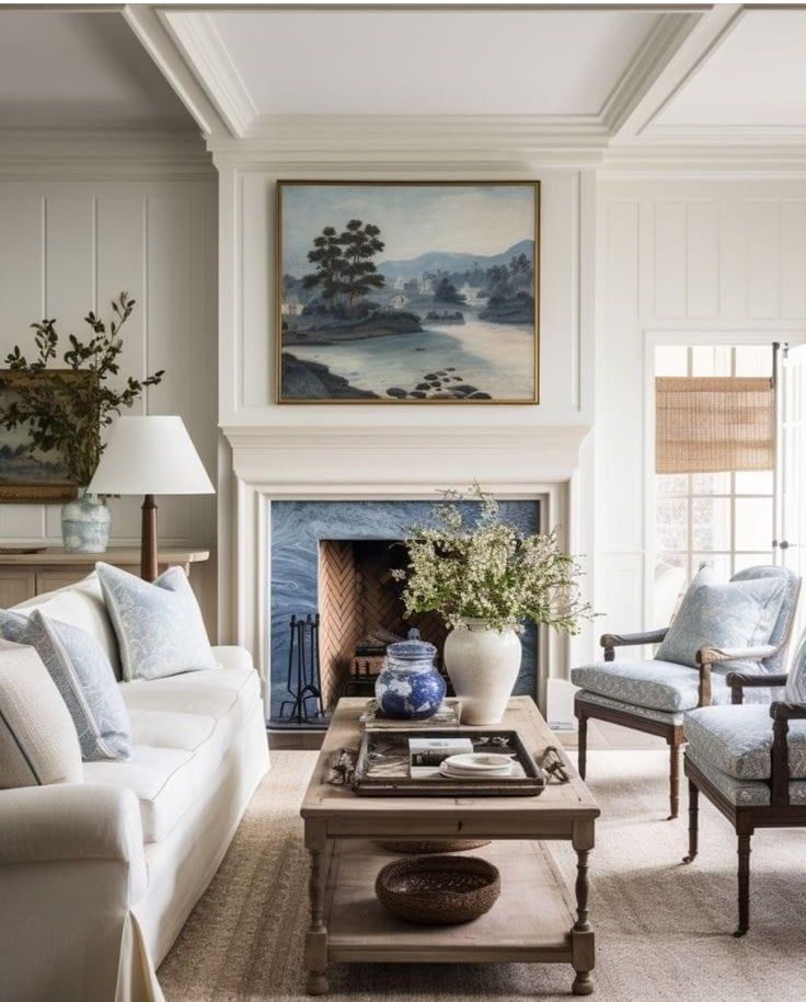 a living room filled with furniture and a painting on the wall above a fire place