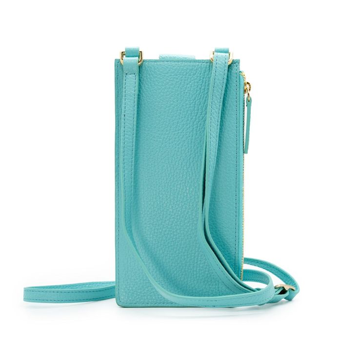 A miniature marvel of form and function, the Paris Phone Pouch holds all your necessary essentials securely in style. Made of gorgeous Italian leather in an aqua blue hue, it stores any sized phone in the main compartment, plus there’s also three credit card/ID pockets. Securing your phone in place with a top flap snap, this crossbody-style bag also has a side zipped section for keys and other must-haves. The Paris is perfect for a night out when a little bag goes a long way — just toss the adju Blue Phone Bag With Cell Phone Pocket For On-the-go, Functional Blue Phone Bag With Cell Phone Pocket, Versatile Blue Phone Bag For Travel, Functional Blue Rectangular Phone Bag, Blue Phone Bag With Removable Pouch For Travel, Travel Blue Phone Bag With Removable Pouch, Travel Phone Bag With Removable Pouch In Blue, Modern Phone Bag With Card Slots For On-the-go, Blue Versatile Phone Bag For Everyday Use