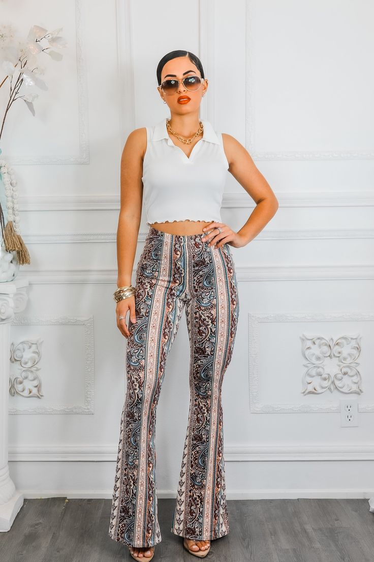 Make a stylish statement with our Paisley Infusion Bell Bottoms. With a playful paisley print, these pants are perfect for adding a touch of personality to any outfit. Buttery soft with great stretch, they're also comfortable and versatile. Perfect for standing out from the crowd in a fun and sexy way. Model is 5’4 wearing 3 1/2 in heals: size small Fit’s true to size One Shoulder Tops, Cutie Pie, Cropped Top, Black Maxi Dress, Fashion Tops, Paisley Print, Bell Bottoms, Brunei, Casual Tops