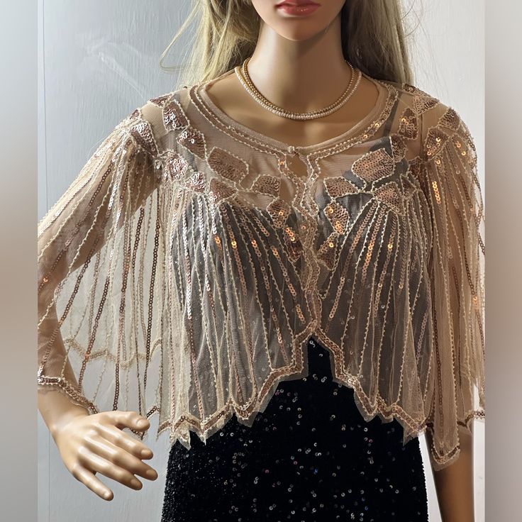 Sequin Embellished Fringed Cape Be A Glamorous Queen Dress To Pair With Your Dress Or Jeans. Sequin Designed Size One Size Fits Most Bust Size 29’ Height 13’ Shoulder Length Length ¾ Shoulder Fabric Polyester Hand Wash Elegant Long Sleeve Embellished Tops, Elegant Tops For Fall Celebration, Elegant Fall Celebration Tops, Elegant Embellished Tops For Festive Season, Glamorous Hand Embellished Tops For Party, Elegant Long Sleeve Sparkling Tops, Elegant Sparkling Tops For Festive Occasions, Elegant Beaded Tops For Wedding, Elegant Sparkling Long Sleeve Tops