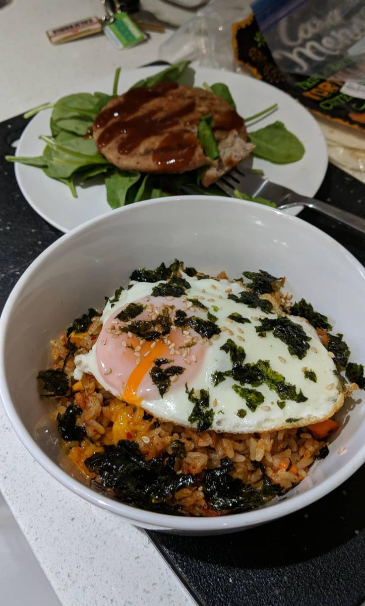 two plates filled with food on top of a table