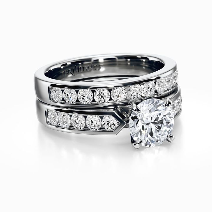 a couple of wedding rings on top of each other with a diamond in the middle