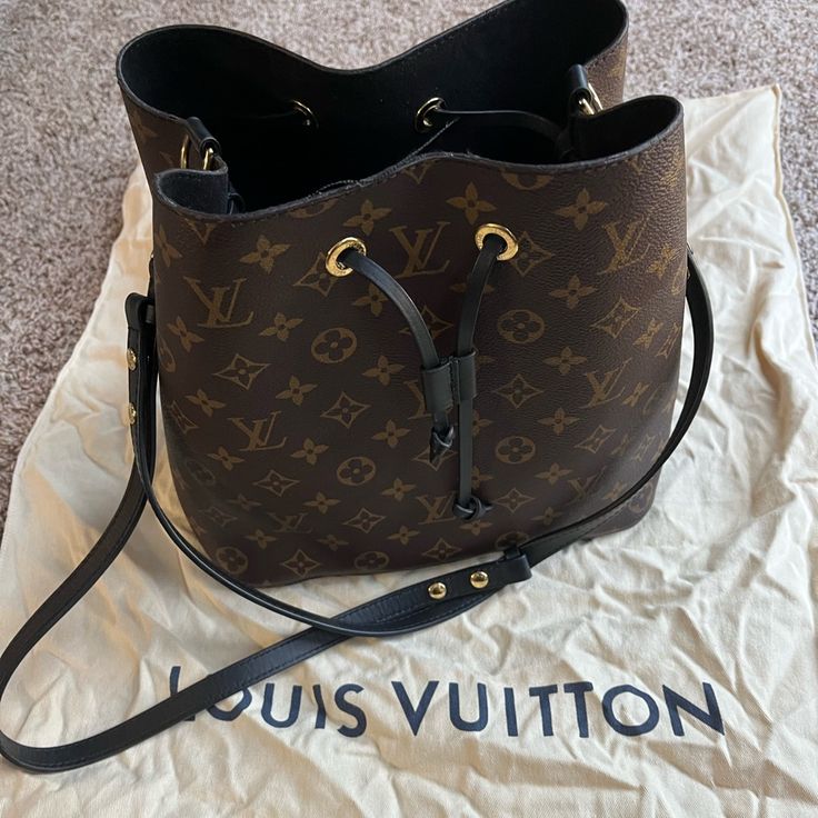 Still In Great Condition Because It Was Never Worn As An Everyday Bag. Many Ppl I See Have Heavy Darkening, Peeling, Cracking Of The Leather Of The Straps And The Strap Wax But This Bag Is In Excellent Condition. Have A Lip Gloss Stain In The Inside But Nothing Major. Dust Bag Included. Brown Evening Shoulder Bag In Signature Coated Canvas, Monogram Canvas Bucket Shoulder Bag With Adjustable Strap, Brown Signature Coated Canvas Bag With Adjustable Strap, Daily Use Monogram Canvas Bag With Adjustable Strap, Brown Bag With Detachable Strap In Signature Coated Canvas, Brown Signature Coated Canvas Bag With Detachable Strap, Bucket Bag Satchel With Removable Pouch In Monogram Canvas, Monogram Canvas Satchel Bucket Bag With Removable Pouch, Monogram Canvas Bucket Bag With Removable Pouch