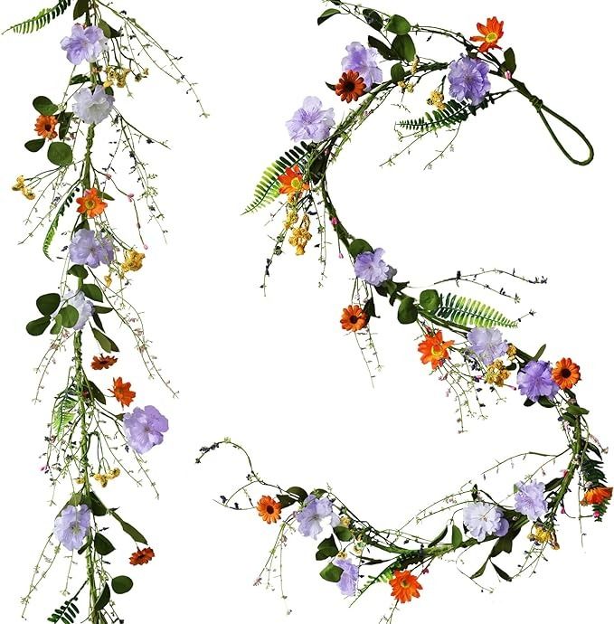 flowers and leaves are arranged in the shape of letters