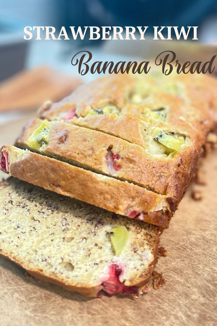 a loaf of banana bread on top of a cutting board with the words, strawberry kiwi banana bread