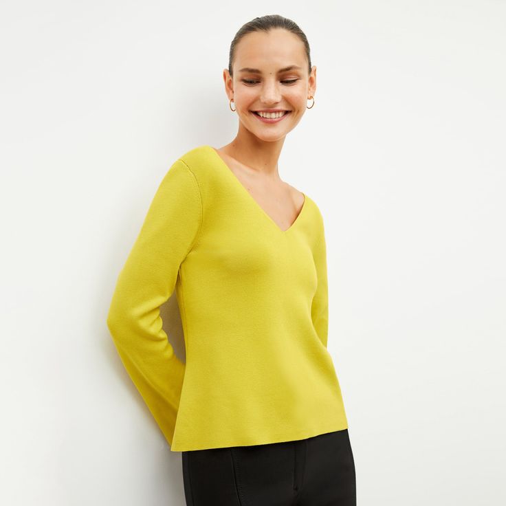 The Kara is made from our machine-washable 365Knit—a cotton blend that’s equal parts stretch and structure. Its sleek-yet-relaxed silhouette subtly stands out thanks to small side seam notches and a V-neck that’s mirrored in the back. Made in China with fabric from China. Spring V-neck Soft Knit Stretch Sweater, Fitted Soft Knit Top For Work, Fitted Fine Knit V-neck Sweater For Spring, Spring Knit Tops For Workwear, Modern Fitted Sweater Solid Color, Fitted Knit V-neck Sweater For Spring, Fitted Knit Tops For Work, Spring V-neck Soft Stretch Knit Sweater, Versatile Stretch Knit Top