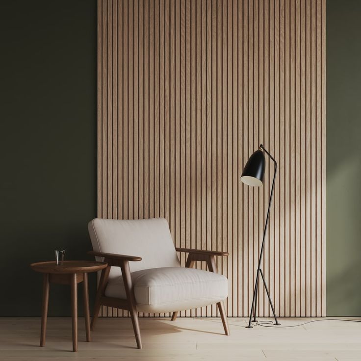 a chair and table in front of a wall with vertical slatted wood panels