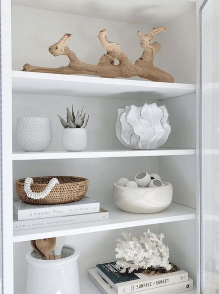 white shelves filled with vases and books