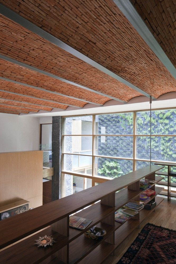 a living room filled with furniture and lots of windows