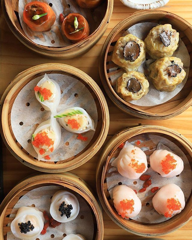 several small bowls filled with different types of food