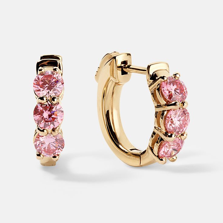 Oh la la!  Wowsers, sooo beautiful!  You cannot NOT look at these stunning earring s.  Three good sized brilliant pink diamonds set in precious gold huggy style earrings. These will be your new favorites. Each diamond is about 3.5mm diameter, set closely to each other.  The total weight is a full 1ctw of lab-grown pink diamonds.  We use VS clarity, so they sparkle like crazy. The mountings are a solid well made piece with a nice secure latch.  You'll love them.   Give her a gift she will cherish Luxury Pink Hoop Earrings, Luxury Pink Brilliant Cut Diamond Earrings, Luxury Pink Diamond Earrings Brilliant Cut, Luxury Pink Earrings With Brilliant Cut, Pink Cubic Zirconia Hoop Earrings, Pink Cubic Zirconia Hoop Jewelry, Elegant Pink Hoop Earrings, Pink Round Diamond Earrings, Pink Cubic Zirconia Huggie Earrings