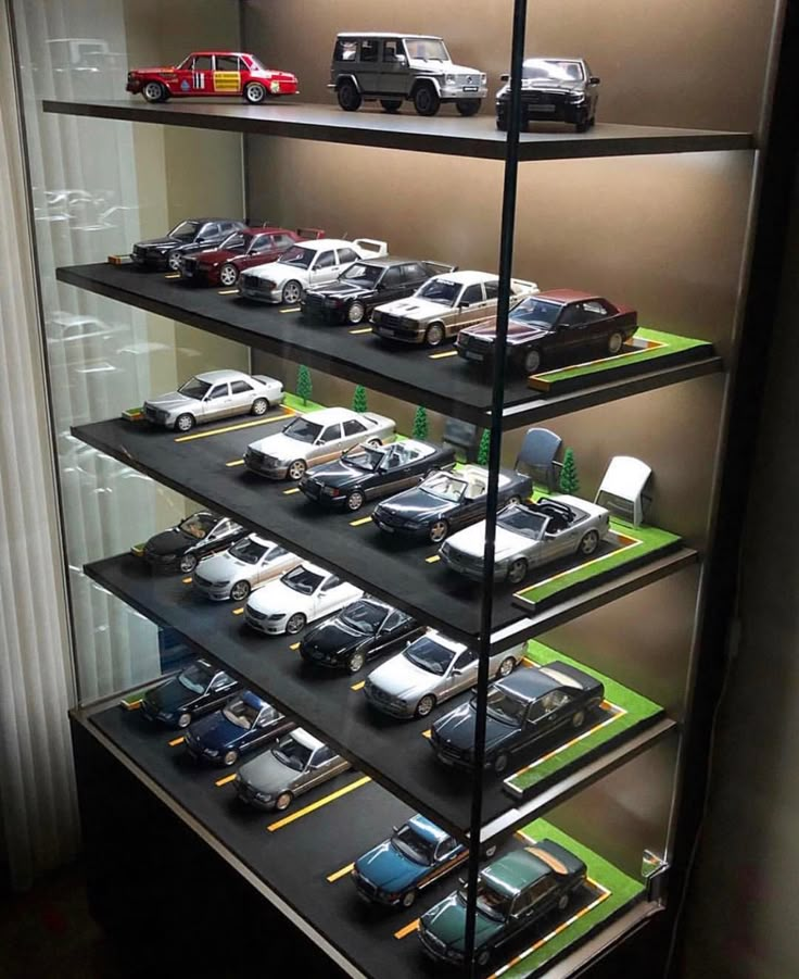 a display case filled with lots of toy cars