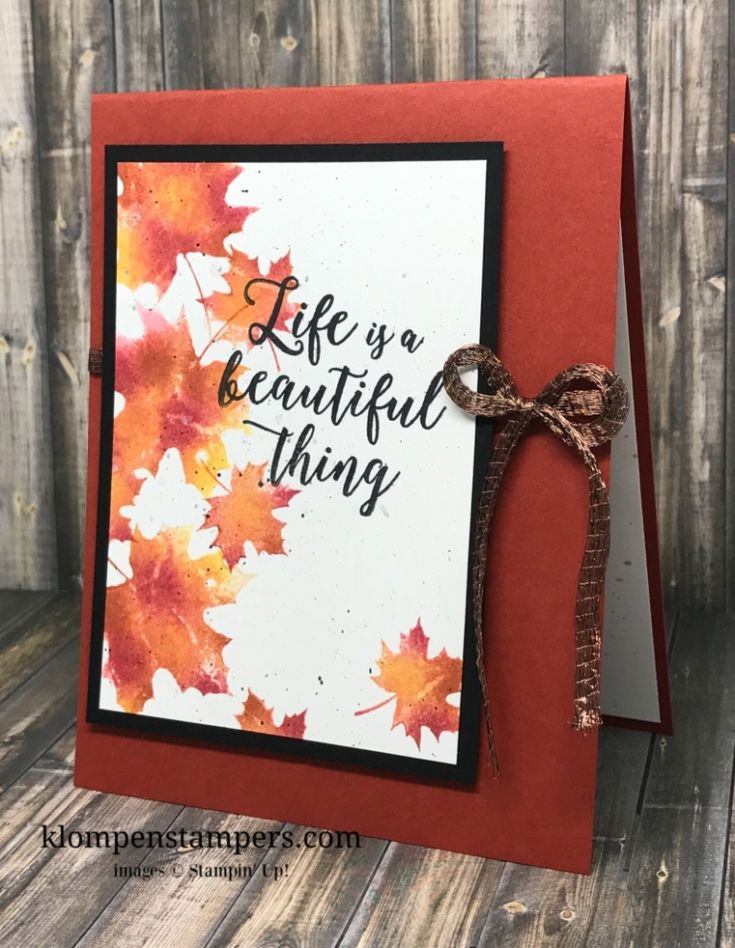 a handmade card with the words life is a beautiful thing written on it and an orange ribbon