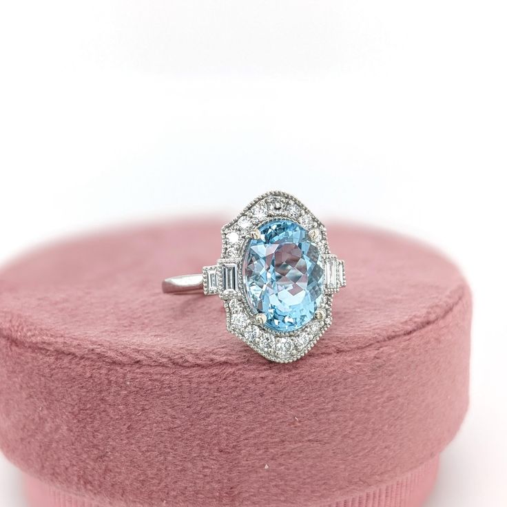 This beautiful ring features a 4.39 carat Aquamarine gemstone with natural earth mined diamonds and milgrain detail, set in solid 14K gold. This Aquamarine ring makes a lovely March birthstone gift for your loved ones! This ring is made with solid 14K Gold and natural Earth mined SI / G-H diamonds. As listed, this ring is ready to ship. If you're interested in purchasing this setting with a different center stone please message us! Designer Silver Jewellery, Jewelry Showcases, Aquamarine Ring, March Birthstone, Birthstone Gifts, Aquamarine Rings, Aquamarine Gemstone, Natural Earth, Beautiful Ring