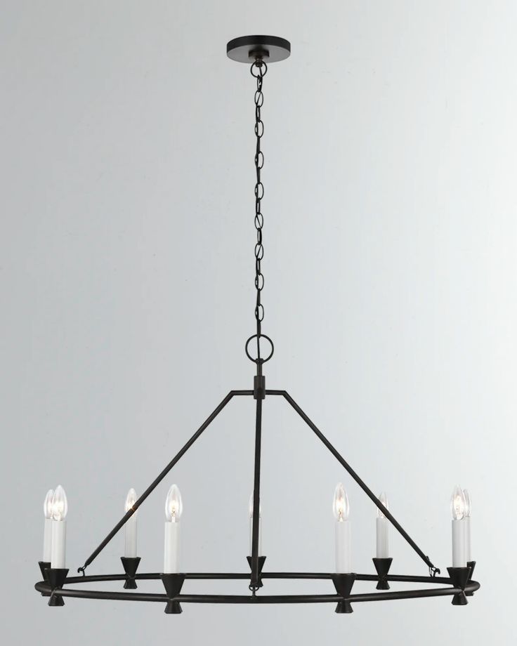 a black chandelier with five candles hanging from the bottom and four lights on each end