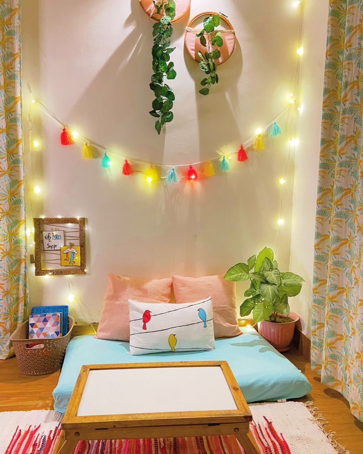 a bed with colorful lights hanging above it