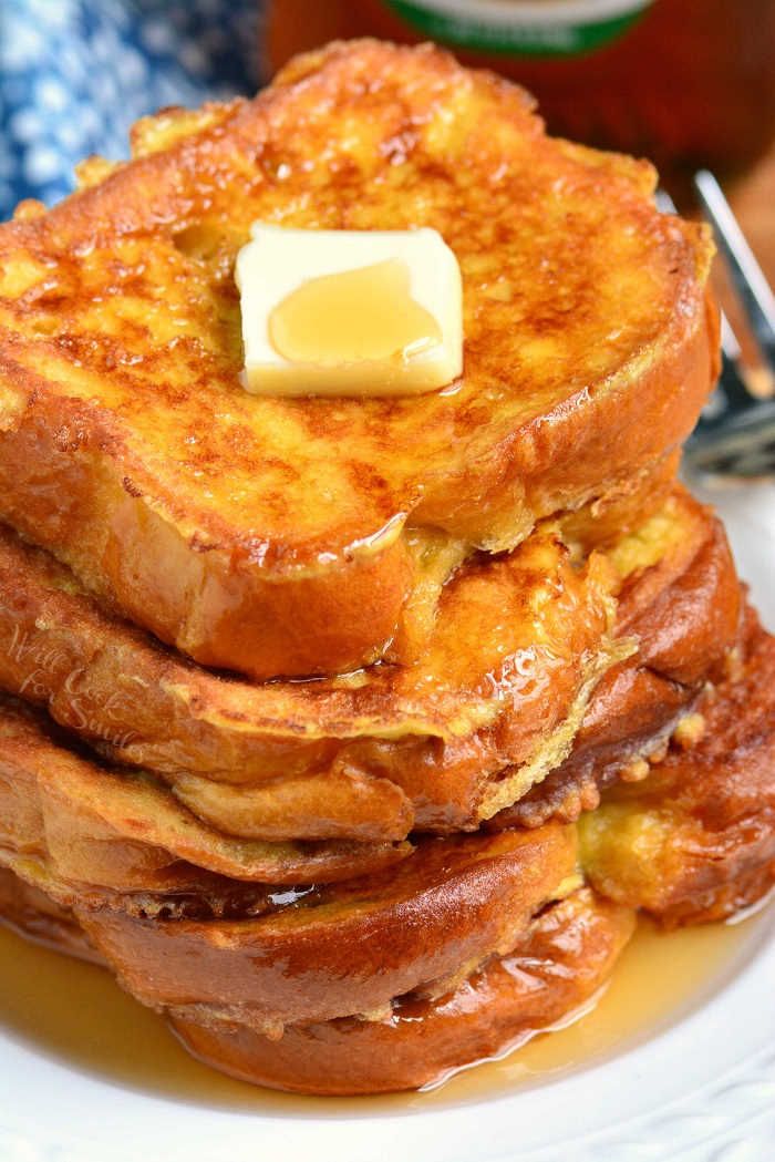 a stack of french toast with butter on top