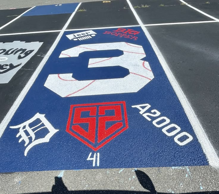 the parking lot has been painted with many different logos