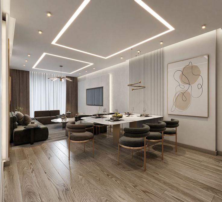 a large dining room with wooden floors and white walls, along with modern chairs and tables