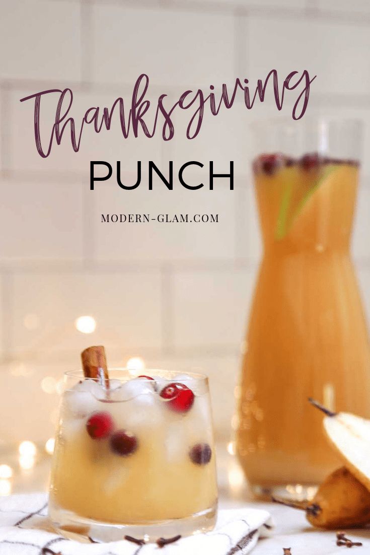 an image of thanksgiving punch with cranberry garnish on the rim and text overlay that reads, thanksgiving punch