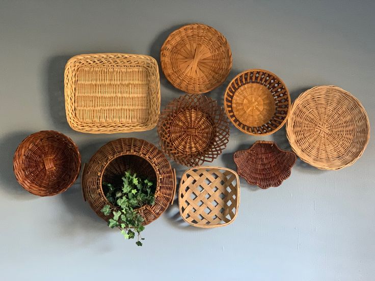 My home has a mix of styles. I’m going for a Boho/ dark academia/ mid century modern/ industrial look. This is a Boho inspired decor. Basket And Macrame Wall, Kitchen Basket Wall Decor, Basket On Wall For Storage, Basket Wall Displays, Basket Wall Decor Bathroom, Wicker Plate Wall Decor, Basket Walls Boho Living Room Diy, Basket Wall With Plants, Circle Basket Wall Decor