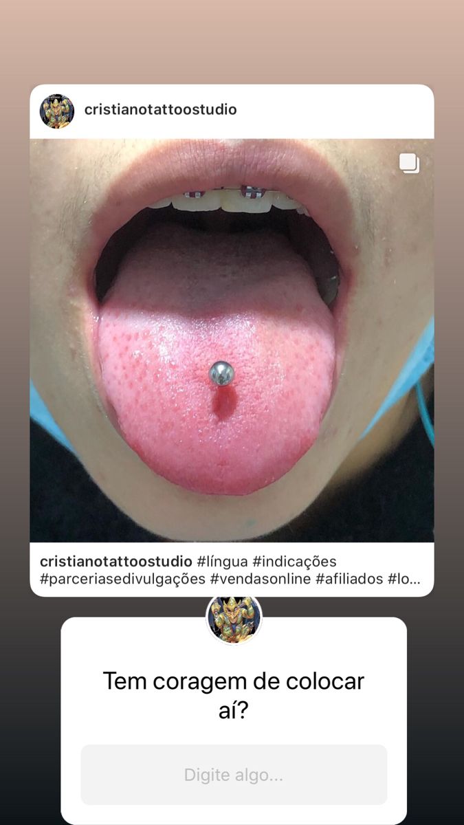 the tongue is pink and has a piercing on it