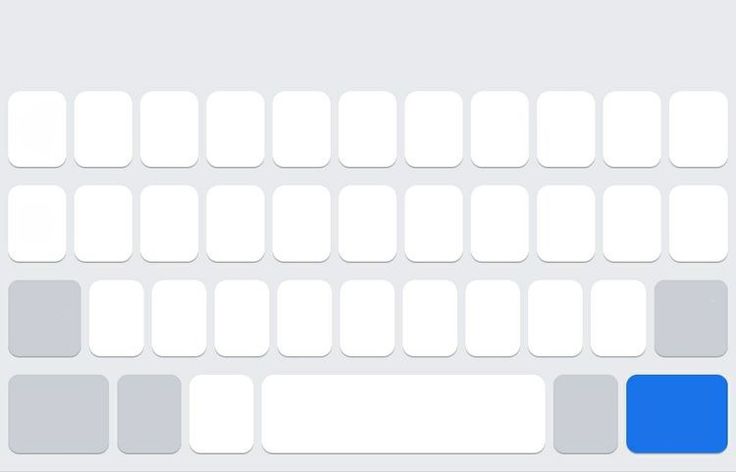 the keyboard is white and has blue buttons on each side, along with several smaller ones