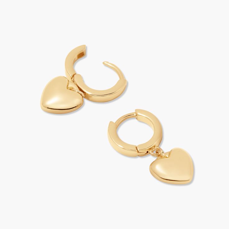 Love is in the air with these golden heart earrings. Showcase your sparkle and make a statement with these perfect pair of hearts – they'll bring the perfect hint of romance to any outfit. Available in 14k gold plated brass 1/2" huggie with 3/8" charm Hinge closure Protected with an anti-tarnish barrier SKU: BYE1165 Gold Open Heart Huggie Earrings For Everyday, Gold Sterling Silver Huggie Earrings For Valentine's Day, Gold Heart-shaped Huggie Earrings For Everyday, Everyday Gold Heart Huggie Earrings, Everyday Gold Heart-shaped Huggie Earrings, Dainty Heart-shaped Tarnish-resistant Huggie Earrings, Valentine's Day Heart Charm Huggie Earrings For Anniversary, Valentine's Day Huggie Earrings With Heart Charm, Valentine's Day Heart Charm Huggie Earrings