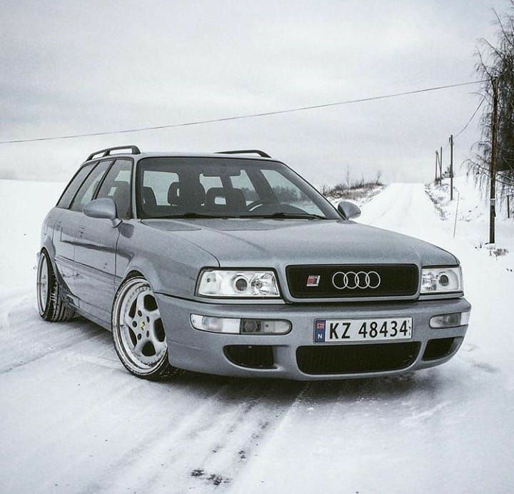 the car is parked on the snowy road