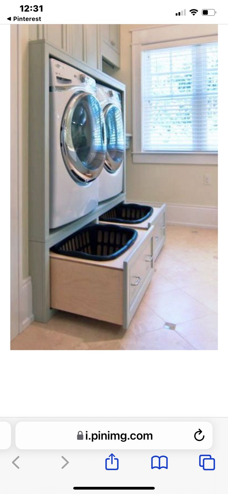 an appliance that is open to show the washing machine in it's drawer