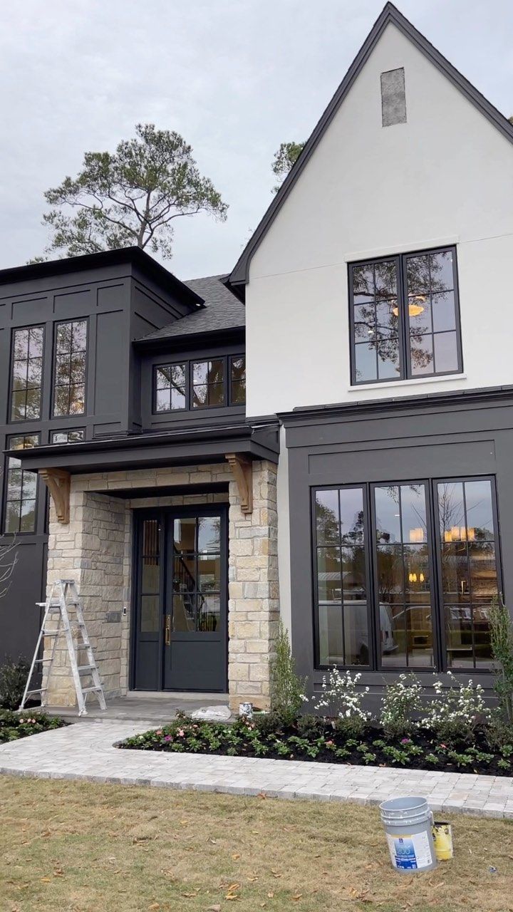 a house that has been painted gray and white