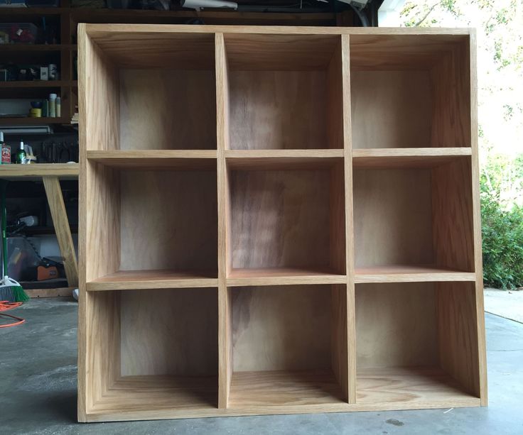 an empty wooden shelf in a garage