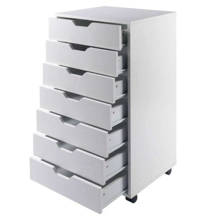 a white drawer with five drawers on wheels and four drawers in the bottom, one is empty