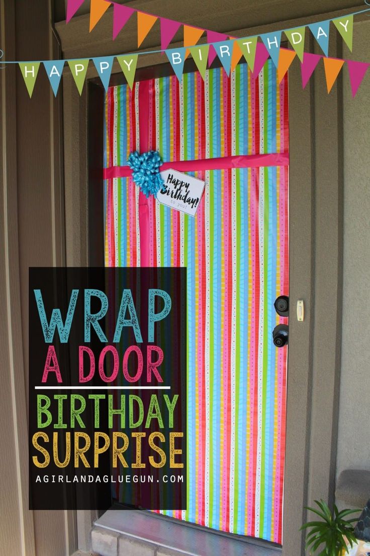 a birthday surprise wrap adorns the front door