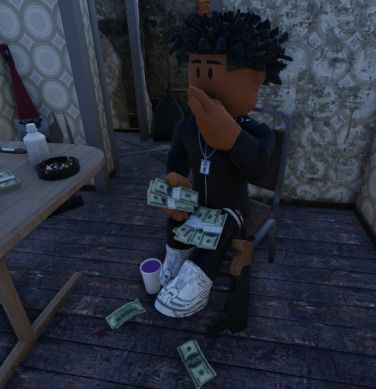 a person sitting in a chair with money on the floor