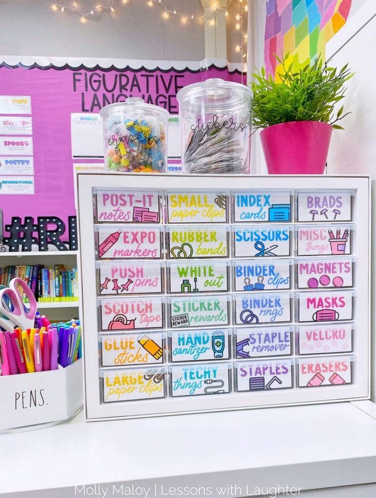 there is a white box with markers and pencils on the shelf next to it